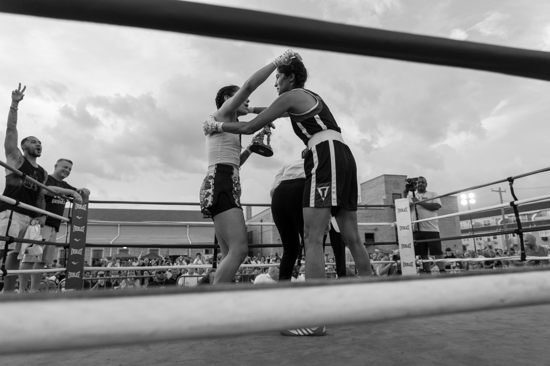 Two boxers embracing after a match